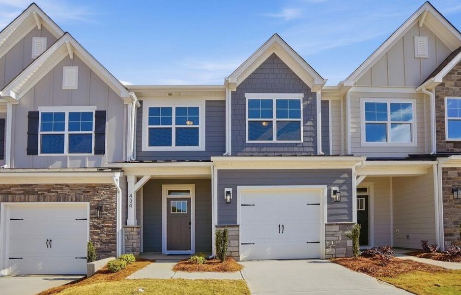 Front exterior of a new home in Blythe Mill Townhomes, Waxhaw, NC, highlighting curb appeal (Image 2). Front exterior of a new home in Blythe Mill Townhomes, Waxhaw, NC, highlighting curb appeal (Image 2).