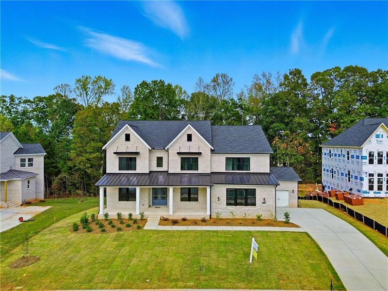 Front exterior of a new home in , Cumming, GA, highlighting curb appeal (Image 26).