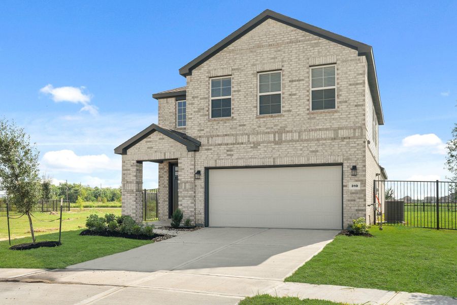 Front exterior of a new home in River Ranch Trails, Dayton, TX, highlighting curb appeal (Image 19). Front exterior of a new home in River Ranch Trails, Dayton, TX, highlighting curb appeal (Image 19).