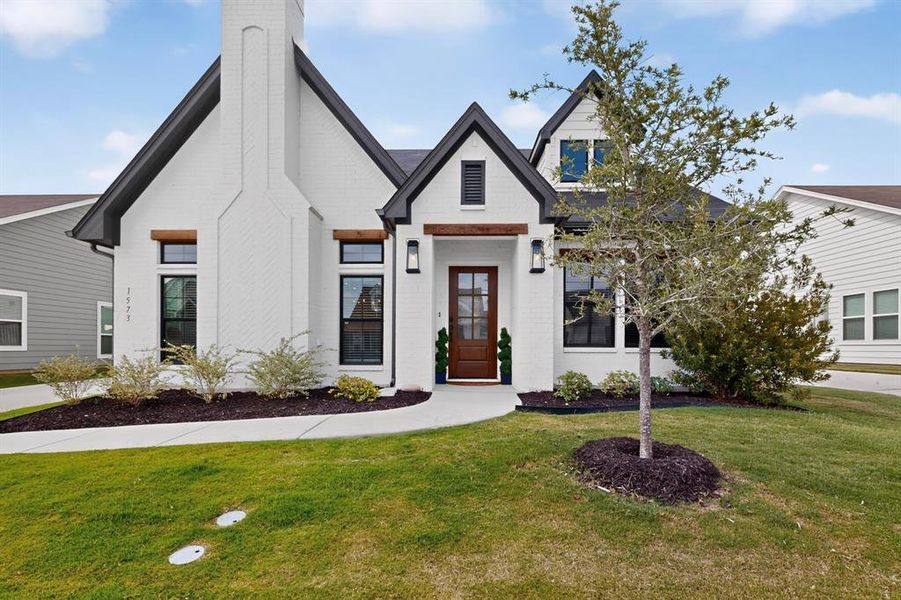 Most adorable cottage style home with cedar accents and that beautiful custom front door is breath taking