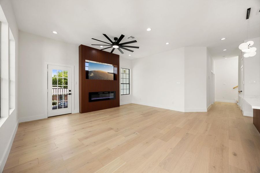 Additional view of the living space and hallway to the third level.
