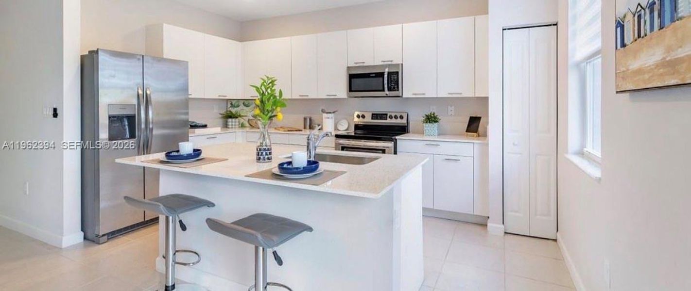 Furnished interior view inside a new home in , Homestead (Image 13). Furnished interior view inside a new home in , Homestead (Image 13).