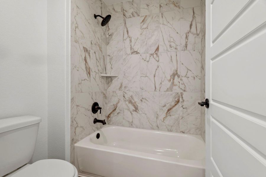 The upstairs bedrooms share a jack-and-jill bathroom.