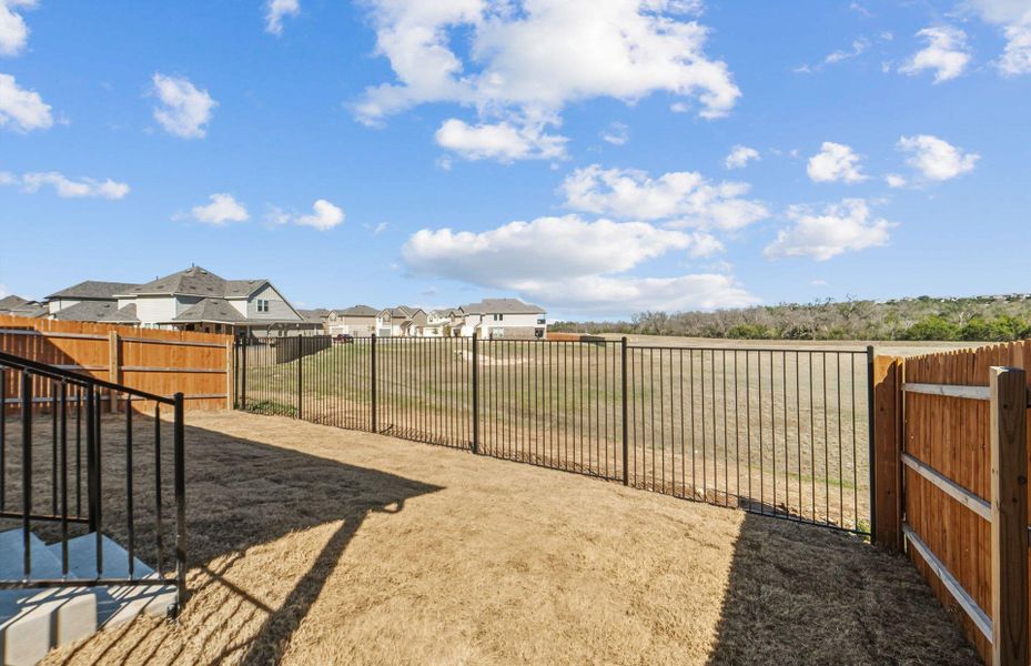 Exterior details and patio area of a home in Saddleback at Santa Rita Ranch, Liberty Hill (Image 20).