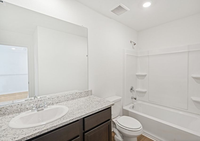 Secondary bathroom with a dual shower and tub. Secondary bathroom with a dual shower and tub.