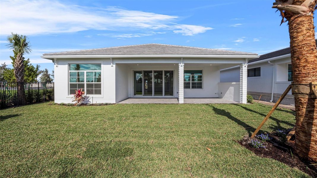Exterior details and patio area of a home in Esprit at Avenir, Palm Beach Gardens (Image 4).