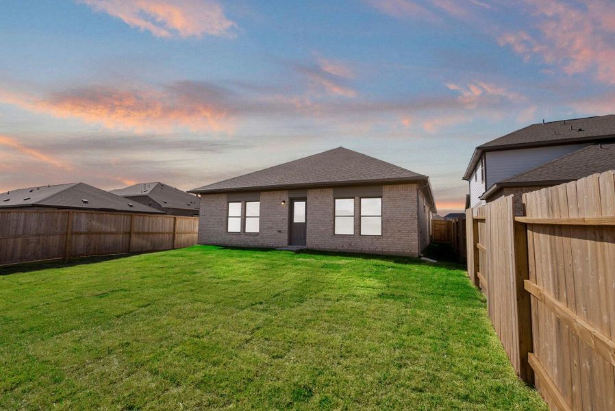 Exterior details and patio area of a home in Windrose Green, Angleton (Image 3).