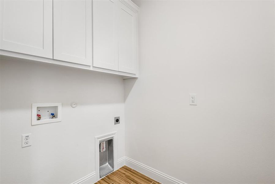 Beautiful storage cabinets in laundry room