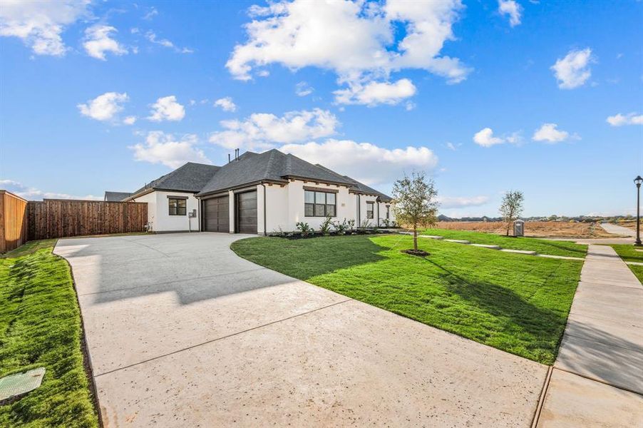 Front exterior of a new home in NorthGlen, Haslet, TX, highlighting curb appeal (Image 23).