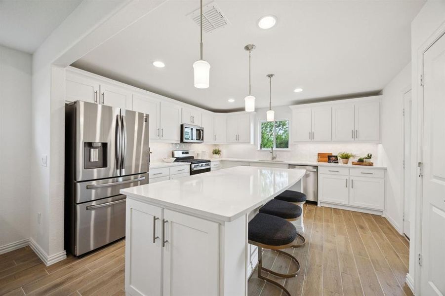 Other features of the kitchen include brushed nickel fixtures and hardware, wonderful storage, recessed lighting and natural light.