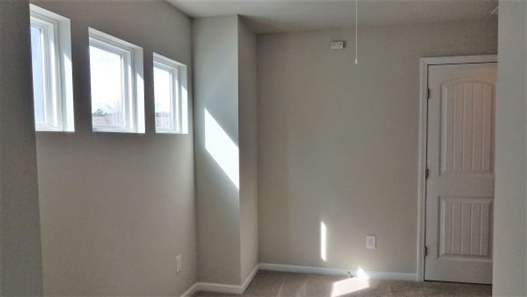 Representative unfurnished interior of a home built from the Emory by Piedmont Residential in Falls Creek, Flowery Branch (Image 19).