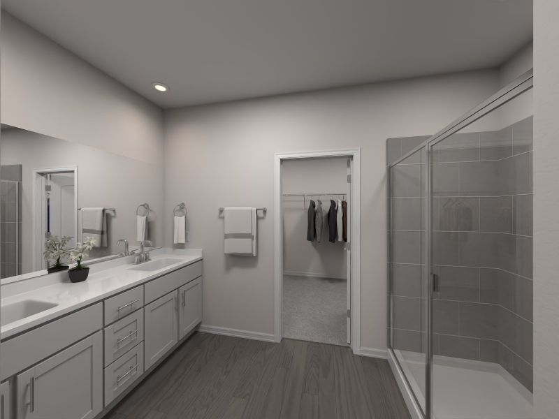 The primary bathroom offers dual vanity sinks and walk-in shower.