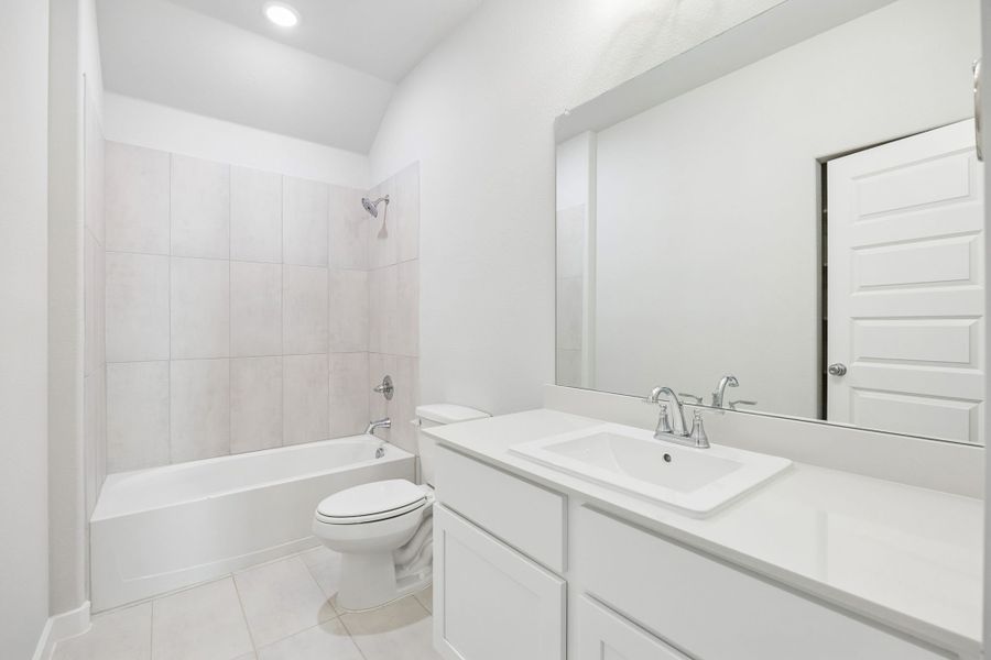 Bathroom in the Oscar home plan by Trophy Signature Homes – REPRESENTATIVE PHOTO