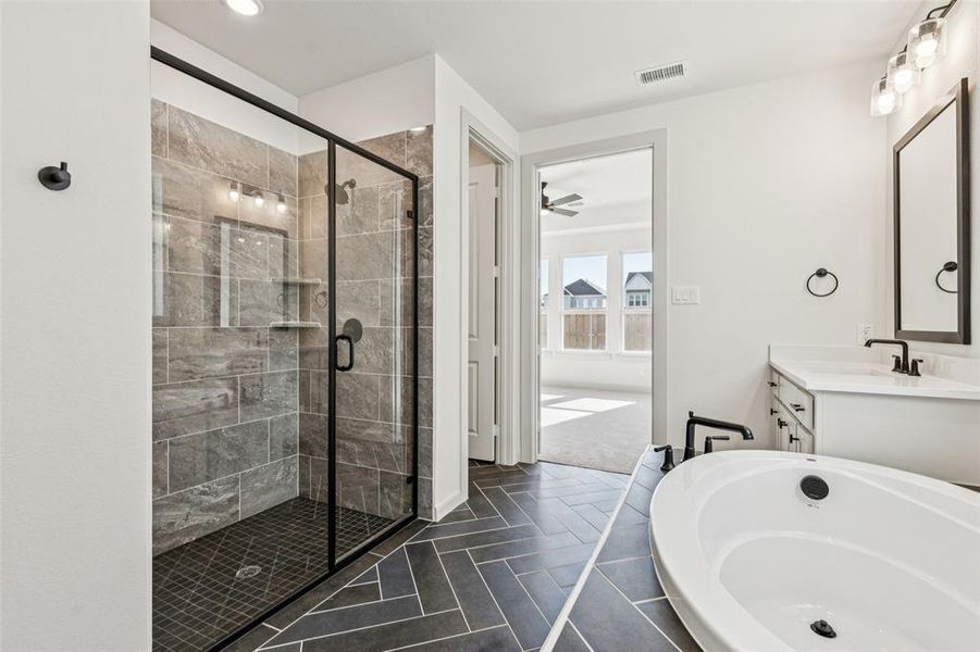 With a spacious walk in shower and wonderful soaking tub, this owner's bath is everything you have been searching for!