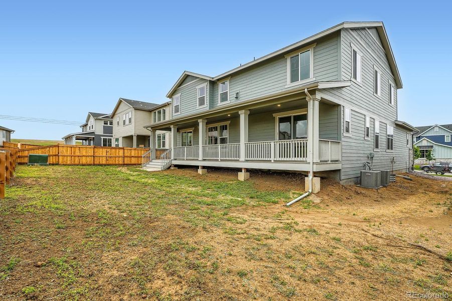 Exterior details and patio area of a home in Sunset Village: The Grand Collection, Erie (Image 2). Exterior details and patio area of a home in Sunset Village: The Grand Collection, Erie (Image 2).