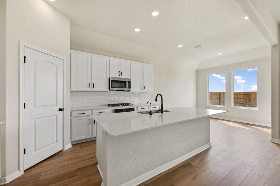 Representative furnished interior of a home built from the Manchester II by Ashton Woods in Lagos Reserve, Manor (Image 12).