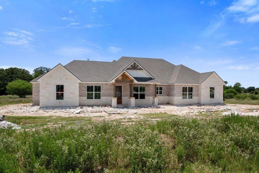 Front exterior of a new home in , Bryan, TX, highlighting curb appeal (Image 2). Front exterior of a new home in , Bryan, TX, highlighting curb appeal (Image 2).