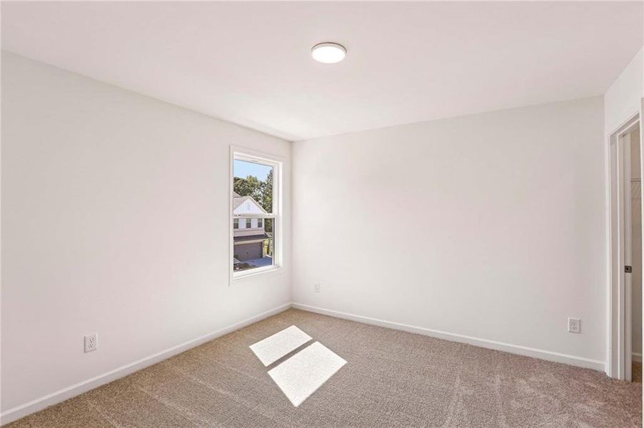 Spacious, unfurnished interior of a new home in Eastlyn Crossing, Flowery Branch (Image 13).
