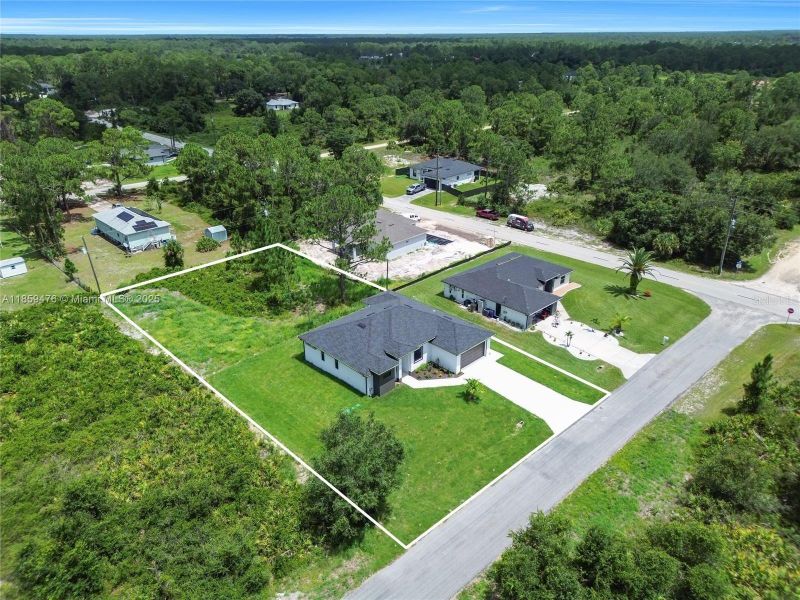 Front exterior of a new home in , Lehigh Acres, FL, highlighting curb appeal (Image 19). Front exterior of a new home in , Lehigh Acres, FL, highlighting curb appeal (Image 19).