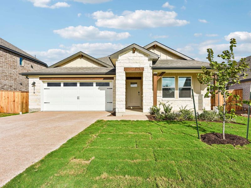 Front exterior of a new home in Colony at Cole Springs - Boulevard Collection, Buda, TX, highlighting curb appeal (Image 1). Front exterior of a new home in Colony at Cole Springs - Boulevard Collection, Buda, TX, highlighting curb appeal (Image 1).