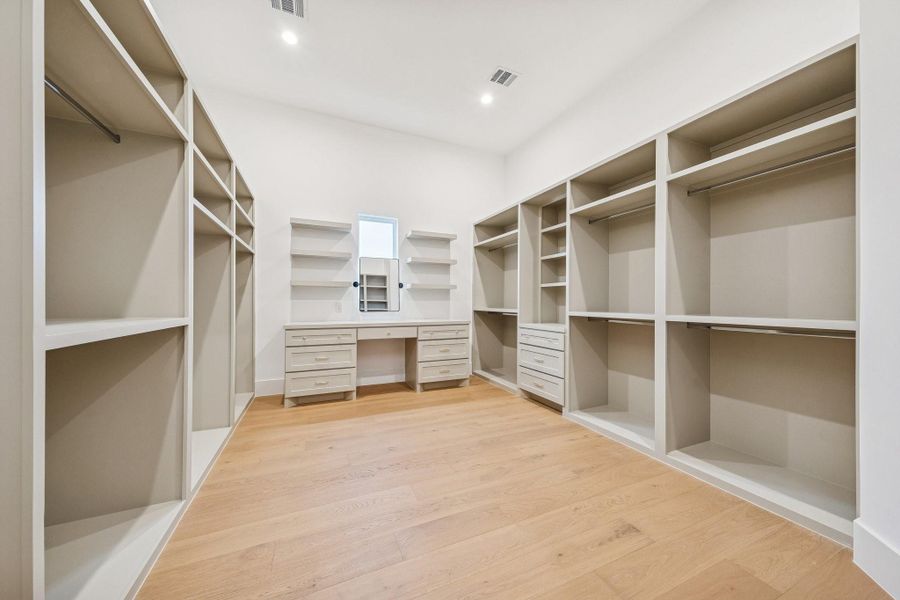 HERS closet, generously sized with a vanity