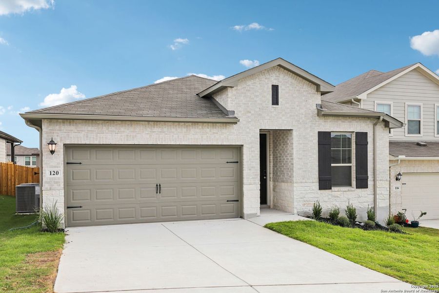 Front exterior of a new home in Legendary Trails - Premier Series, Cibolo, TX, highlighting curb appeal (Image 1).