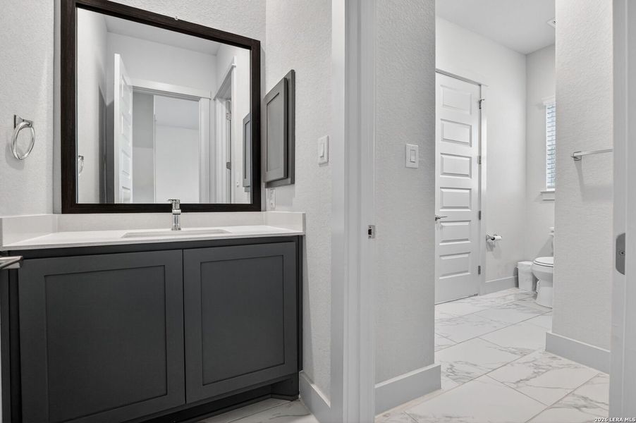 Furnished interior view inside a new home in Pradera Ridge, Floresville (Image 32).