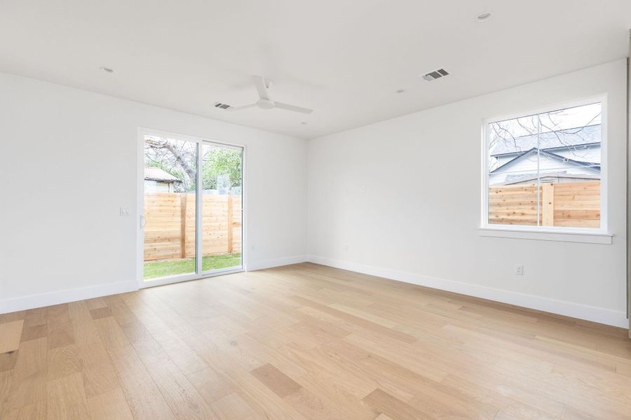 Spare room with light wood-style flooring, ceiling fan, and recessed lighting