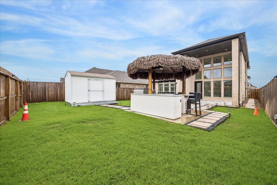 Just imagine the possibilities for this backyard, from a future summer kitchen or custom outdoor lounge to a sparkling pool or expanded patio retreat. The tiki bar will be removed by the seller, while the base pad, electrical wiring & plumbing will remain in place, giving the next owner a head start on bringing their own backyard vision to life.