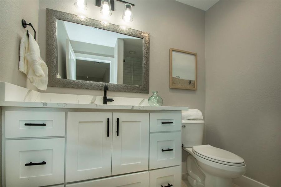 Bathroom with vanity and toilet