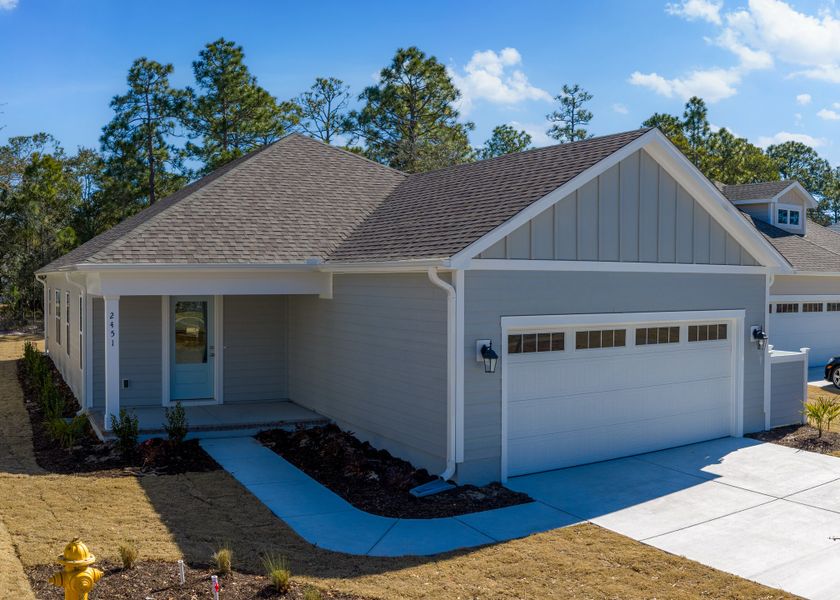 Front exterior of a new home in Osprey Landing, Southport, NC, highlighting curb appeal (Image 28).