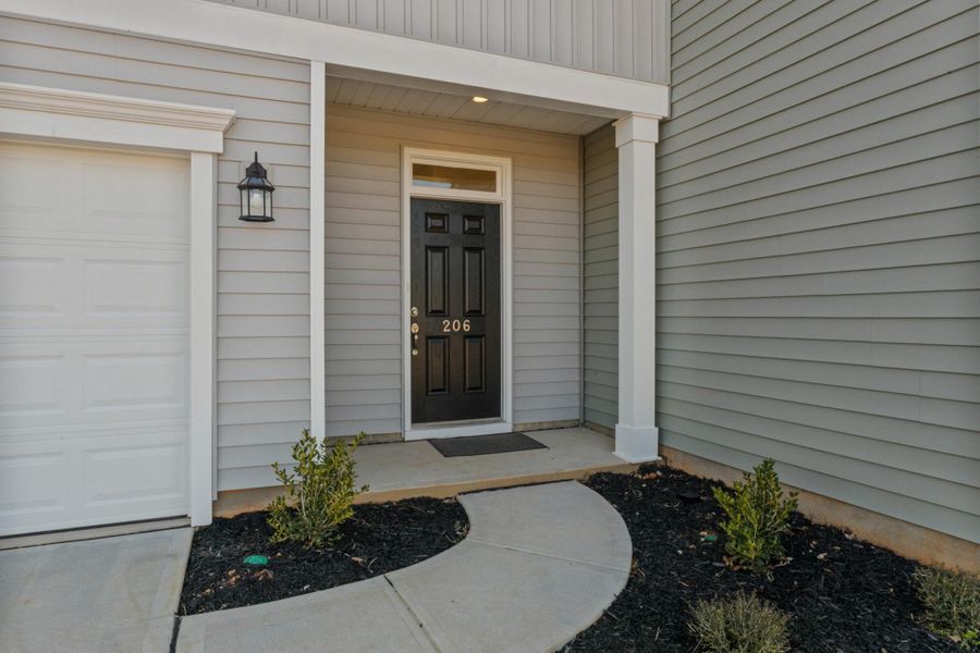 Front exterior of a new home in Bellevue Townhomes, Greenville, SC, highlighting curb appeal (Image 15). Front exterior of a new home in Bellevue Townhomes, Greenville, SC, highlighting curb appeal (Image 15).