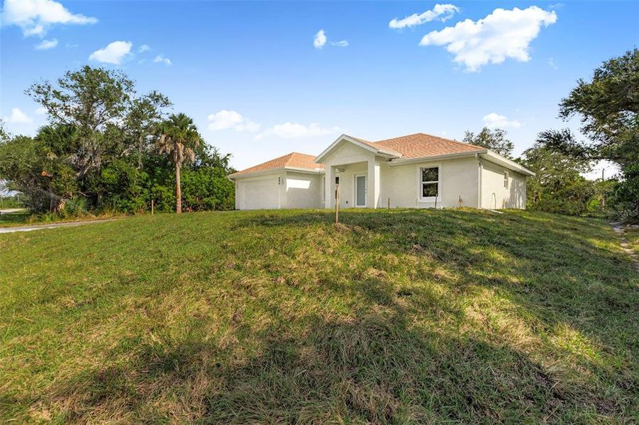 Front exterior of a new home in , Port Charlotte, FL, highlighting curb appeal (Image 21).