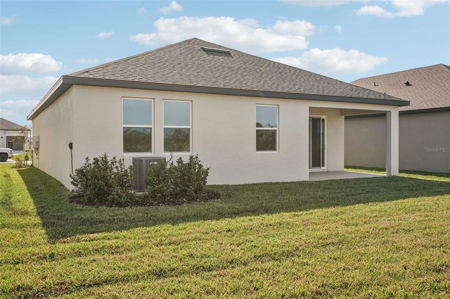 Exterior details and patio area of a home in Oakfield Trails, Parrish (Image 3).