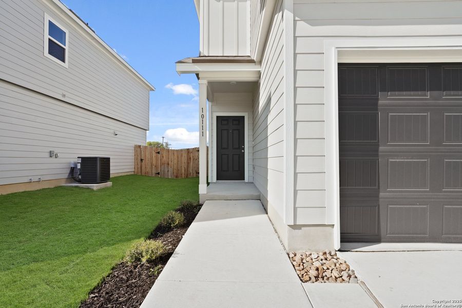 Exterior details and patio area of a home in Melissa Ranch, San Antonio (Image 14).