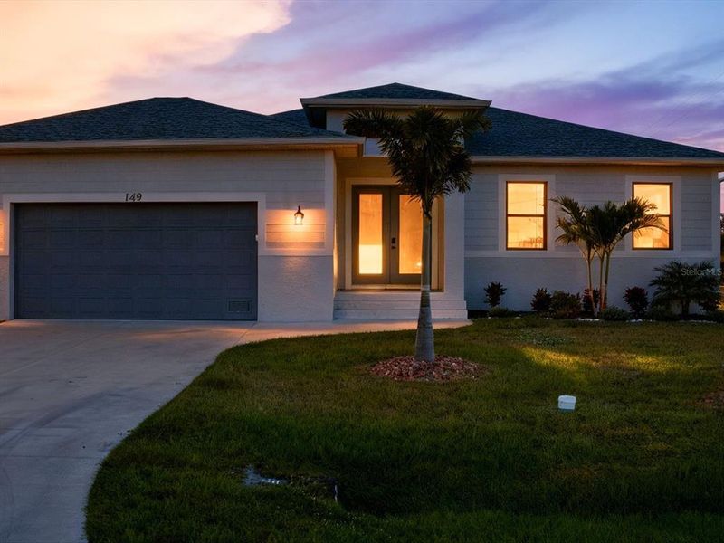 Front exterior of a new home in , Rotonda West, FL, highlighting curb appeal (Image 22).