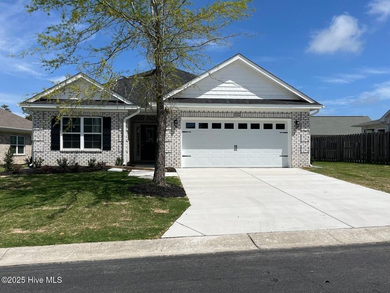 Front exterior of a new home in Palmetto Creek, Bolivia, NC, highlighting curb appeal (Image 1).