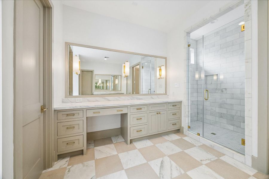 Primary bathroom with large walk-in shower.