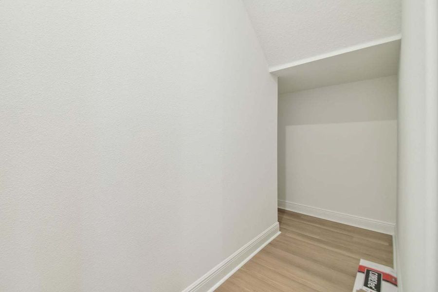 Representative unfurnished interior of a home built from the Sebastian by William Ryan Homes in The Sanctuary – Royal Collection, Punta Gorda (Image 27).