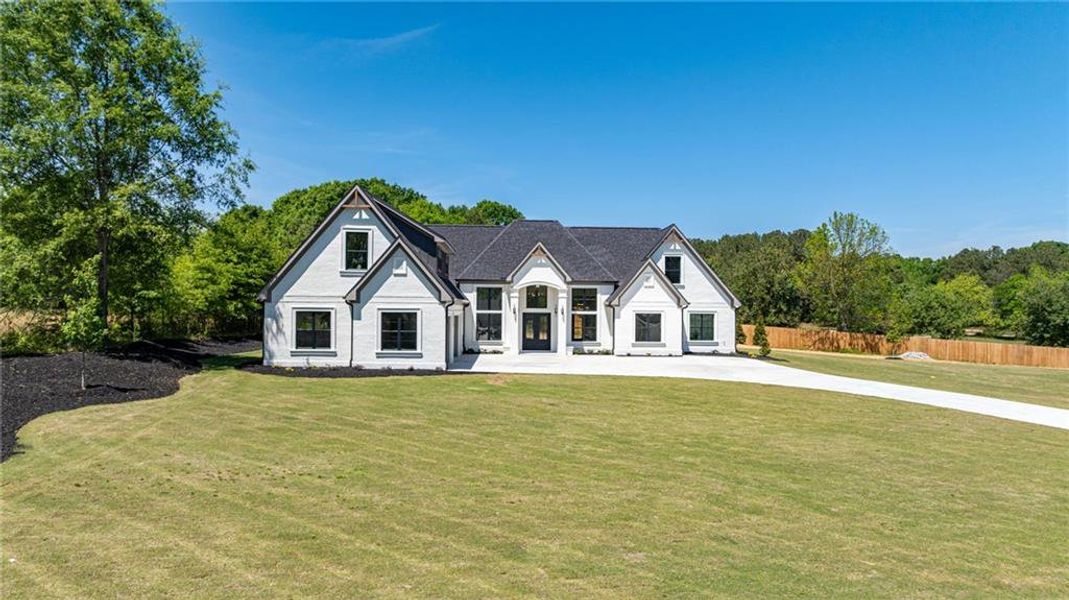Front exterior of a new home in , Monroe, GA, highlighting curb appeal (Image 44).