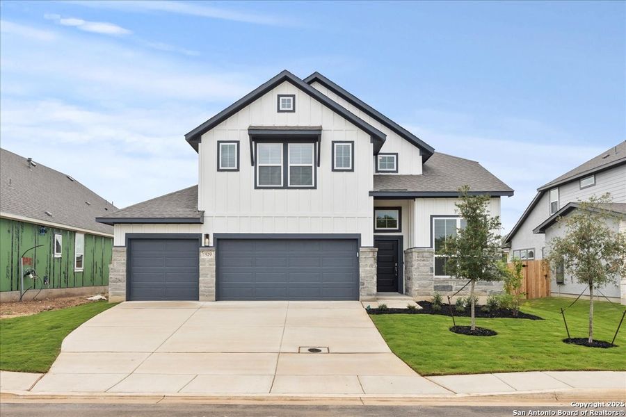 Front exterior of a new home in Village at Three Oaks, Seguin, TX, highlighting curb appeal (Image 14). Front exterior of a new home in Village at Three Oaks, Seguin, TX, highlighting curb appeal (Image 14).
