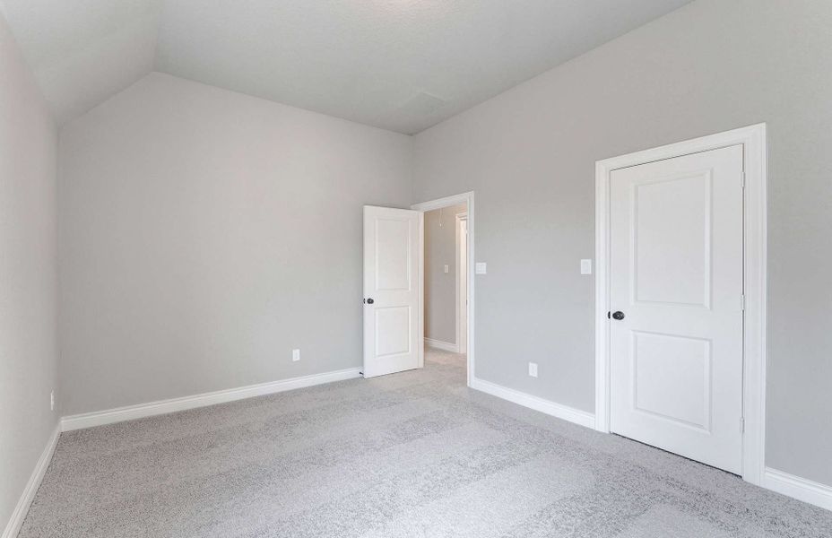 Representative unfurnished interior of a home built from the 3799 by Ravenna Homes in Artavia 70′, Conroe (Image 51).