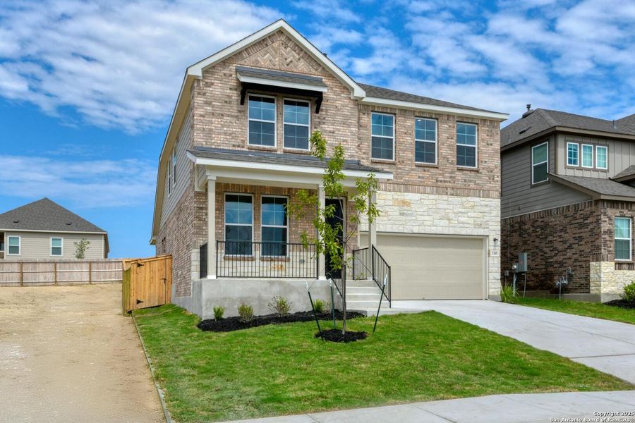 Front exterior of a new home in Arcadia Ridge, San Antonio, TX, highlighting curb appeal (Image 16). Front exterior of a new home in Arcadia Ridge, San Antonio, TX, highlighting curb appeal (Image 16).