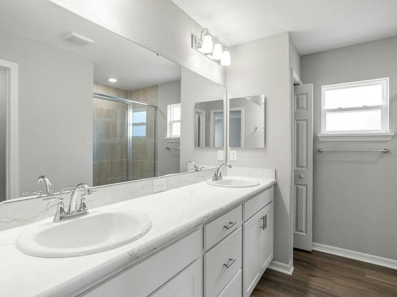 Your suite has a large en-suite bath with a linen closet and tiled shower.