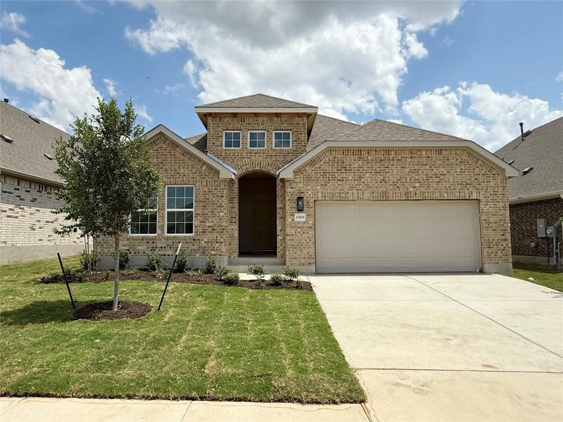 View of front of house featuring brick siding, an attached garage, a shingled roof, and concrete driveway View of front of house featuring brick siding, an attached garage, a shingled roof, and concrete driveway