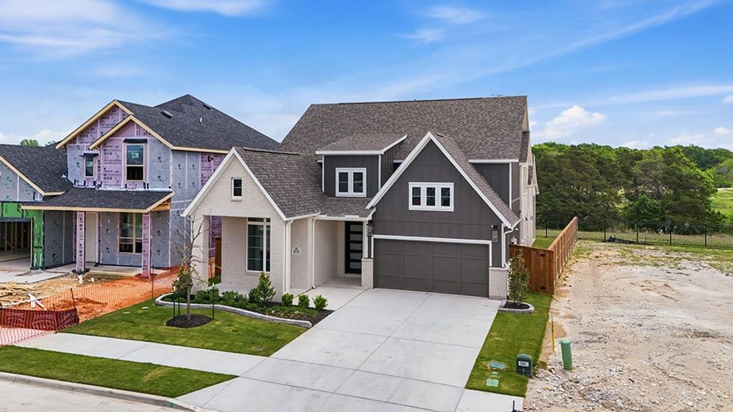 Front exterior of a new home in Aster Park, McKinney, TX, highlighting curb appeal (Image 26).