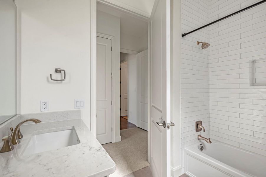 Guest room bathroom, single vanity, shower/bath combo Guest room bathroom, single vanity, shower/bath combo