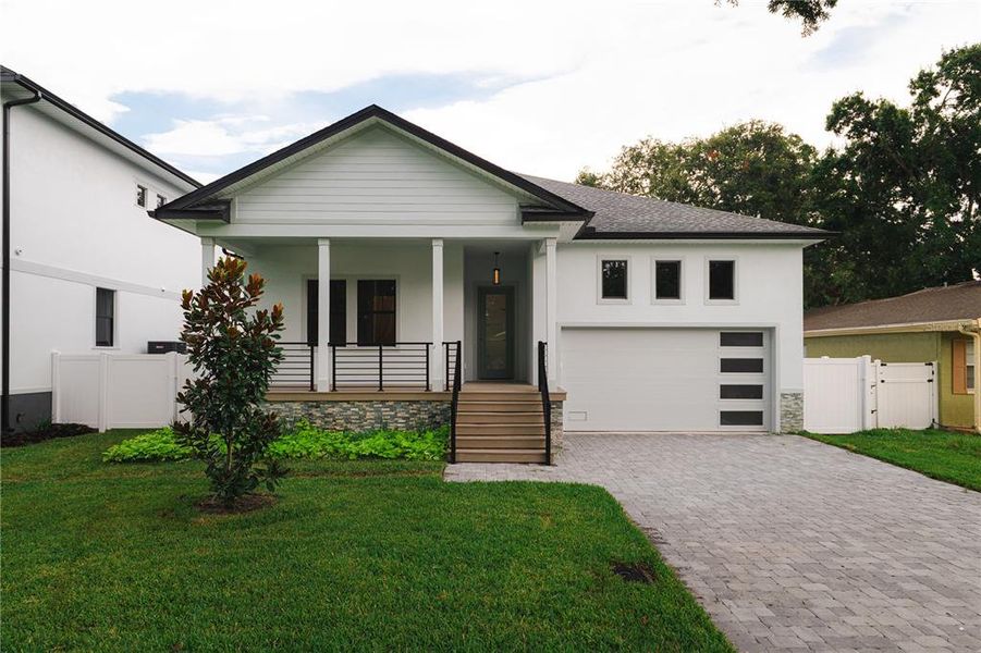 Front exterior of a new home in , Oldsmar, FL, highlighting curb appeal (Image 1). Front exterior of a new home in , Oldsmar, FL, highlighting curb appeal (Image 1).
