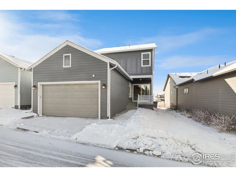 Front exterior of a new home in Kinston Cottage, Loveland, CO, highlighting curb appeal (Image 22). Front exterior of a new home in Kinston Cottage, Loveland, CO, highlighting curb appeal (Image 22).