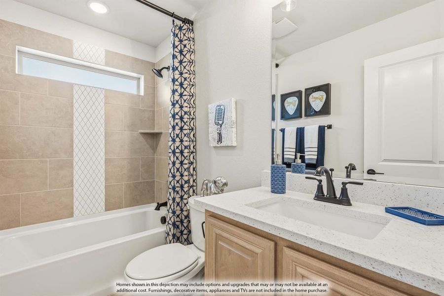 Bathroom with tub-shower combo, tile surround, wood vanity, and quartz countertop